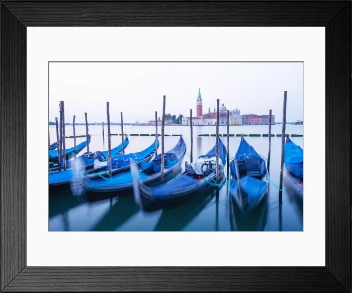 Framed Print : Serene landscape with clear sunrise sky on piazza San Marco in Venice. Row of gondolas parked on city pier Framed Print : Serene landscape with clear sunrise sky on piazza San Marco in Venice. Row of gondolas parked on city pier