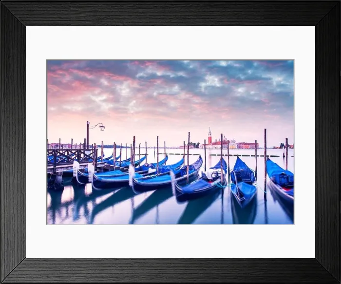 Framed Print : Colorful landscape with pink sunset sky on piazza San Marco in Venice. Row of gondolas parked on city pier Framed Print : Colorful landscape with pink sunset sky on piazza San Marco in Venice. Row of gondolas parked on city pier