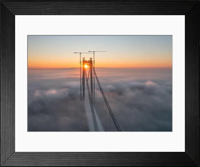 Framed Print : Panoramic aerial drone view from above of the suspended bridge over danube river, under construction, between Braila and Tulcea cities in Romania Framed Print : Panoramic aerial drone view from above of the suspended bridge over danube river, under construction, between Braila and Tulcea cities in Romania