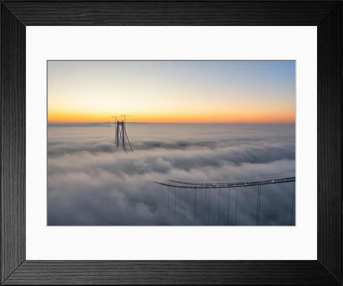 Framed Print : Panoramic aerial drone view from above of the suspended bridge over danube river, under construction, between Braila and Tulcea cities in Romania