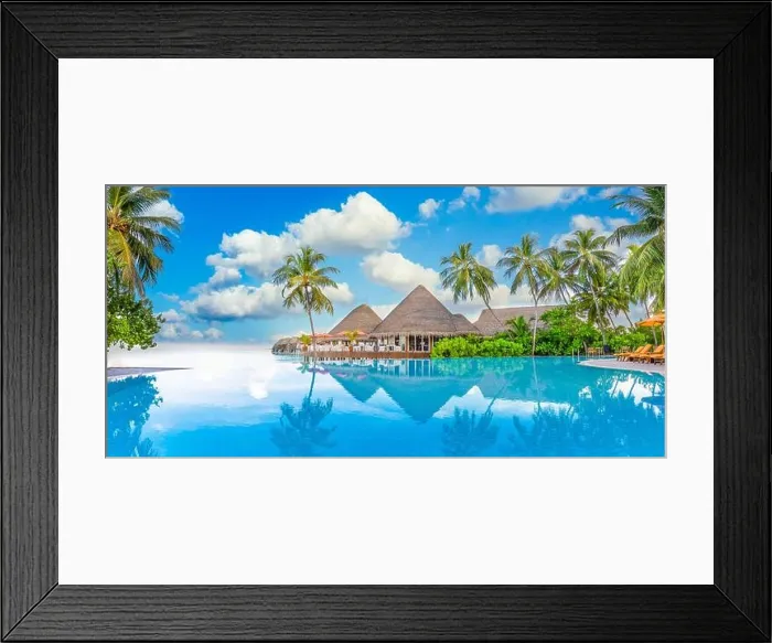 Framed Print : Beachside tourism landscape. Luxurious beach resort poolside, swimming pool and beach chairs beds loungers, umbrellas with tropical palm trees Framed Print : Beachside tourism landscape. Luxurious beach resort poolside, swimming pool and beach chairs beds loungers, umbrellas with tropical palm trees