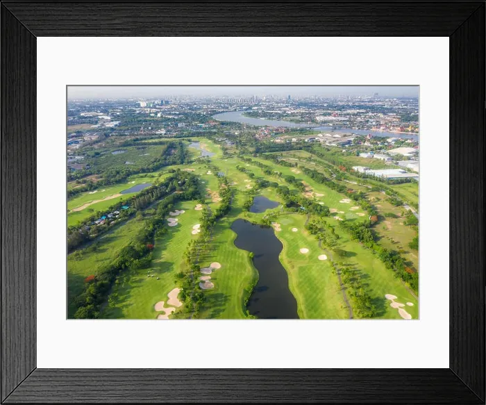 Framed Print : Aerial panoramic view of golf course and houses in city Framed Print : Aerial panoramic view of golf course and houses in city