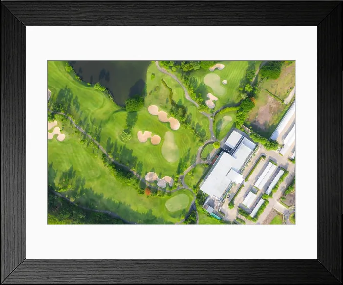 Framed Print : Aerial panoramic view of golf course and houses in city Framed Print : Aerial panoramic view of golf course and houses in city