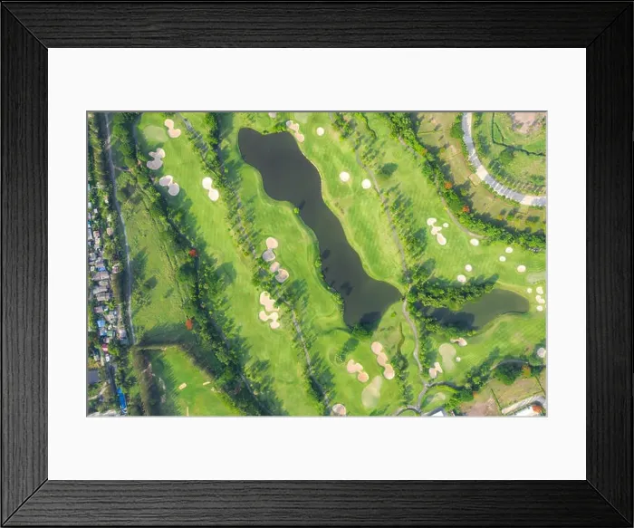 Framed Print : Aerial panoramic view of golf course and houses in city Framed Print : Aerial panoramic view of golf course and houses in city
