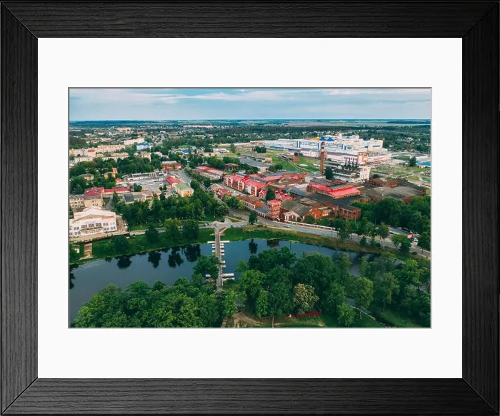 Framed Print : Dobrush, Gomel Region, Belarus. Aerial View Of Old Paper Factory Tower In Spring Day. Historical Heritage In Bird's-eye View Framed Print : Dobrush, Gomel Region, Belarus. Aerial View Of Old Paper Factory Tower In Spring Day. Historical Heritage In Bird's-eye View