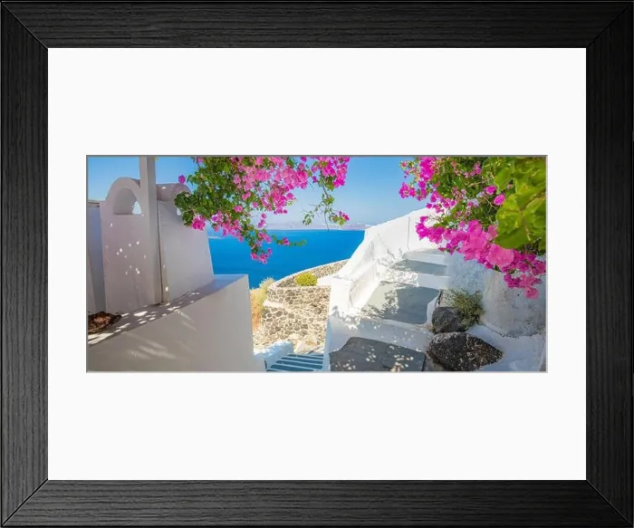 Framed Print : Summer vacation panorama, luxury famous Europe destination. White architecture in Santorini, Greece. Perfect travel scenery with pink flowers Framed Print : Summer vacation panorama, luxury famous Europe destination. White architecture in Santorini, Greece. Perfect travel scenery with pink flowers