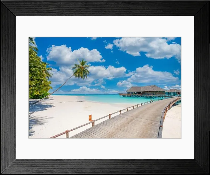 Framed Print : Overwater bungalow in the Indian Ocean. Pier palm trees white sand villas with amazing green lagoon scenic beach view. Picturesque travel landscape Framed Print : Overwater bungalow in the Indian Ocean. Pier palm trees white sand villas with amazing green lagoon scenic beach view. Picturesque travel landscape