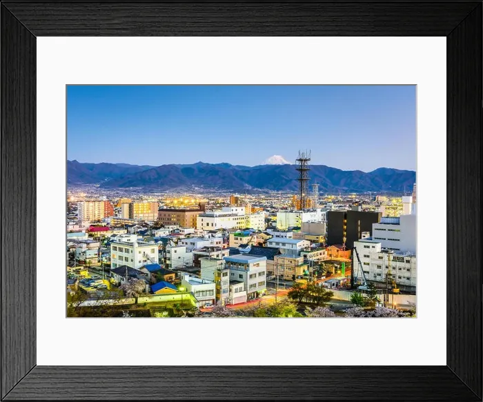 Framed Print : Kofu, Japan city skyline with Mt. Fuji peaking over the mountains Framed Print : Kofu, Japan city skyline with Mt. Fuji peaking over the mountains