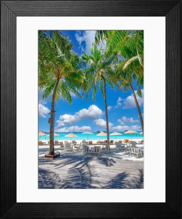Framed Print : Beautiful tropical beach with white sand and chairs loungers on terrace background of turquoise ocean and blue sky with clouds. Scenic palm trees Framed Print : Beautiful tropical beach with white sand and chairs loungers on terrace background of turquoise ocean and blue sky with clouds. Scenic palm trees