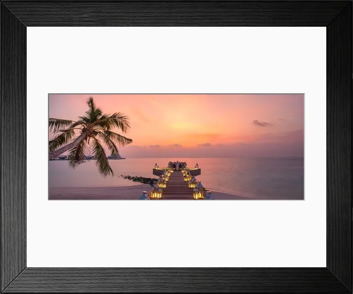 Framed Print : Romantic dinner on the beach with sunset, candles with palm leaves and sunset sky and sea. Amazing view, honeymoon or anniversary dinner landscape Framed Print : Romantic dinner on the beach with sunset, candles with palm leaves and sunset sky and sea. Amazing view, honeymoon or anniversary dinner landscape