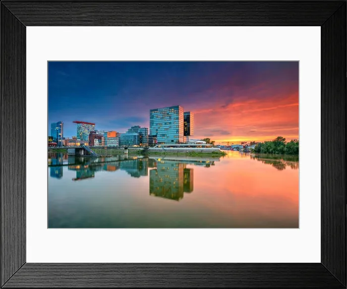 Framed Print : Dusseldorf, Germany. Cityscape image of Düsseldorf with the Media Harbour and reflection of the city in the Rhine river, during twilight Framed Print : Dusseldorf, Germany. Cityscape image of Düsseldorf with the Media Harbour and reflection of the city in the Rhine river, during twilight