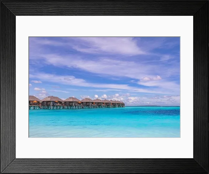 Framed Print : Tropical seascape with water bungalows in the Maldives. Peaceful seaside, stunning beach. Destination for honeymoon and perfect couple vacations Framed Print : Tropical seascape with water bungalows in the Maldives. Peaceful seaside, stunning beach. Destination for honeymoon and perfect couple vacations
