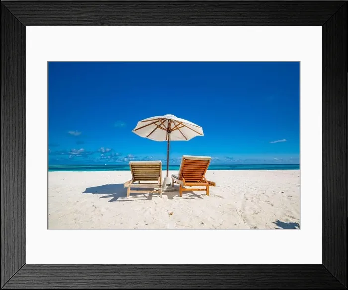 Framed Print : Beautiful tropical beach, two sun beds, loungers, umbrella under palm tree. White sand, sea view horizon, blue sky, calmness and relax resort scenery Framed Print : Beautiful tropical beach, two sun beds, loungers, umbrella under palm tree. White sand, sea view horizon, blue sky, calmness and relax resort scenery