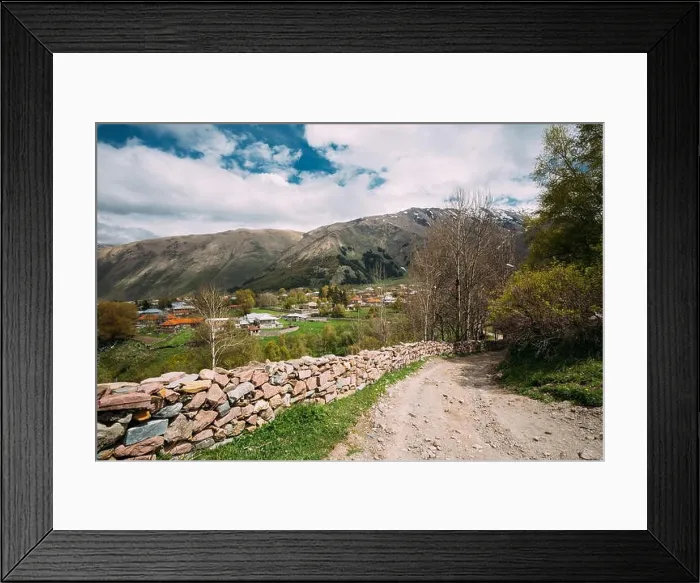 Framed Print : Stone Fence Along A Countryside Road Near Sioni Village In Kazbegi District, Mtskheta-mtianeti Region, Georgia. Spring Or Summer Season Framed Print : Stone Fence Along A Countryside Road Near Sioni Village In Kazbegi District, Mtskheta-mtianeti Region, Georgia. Spring Or Summer Season