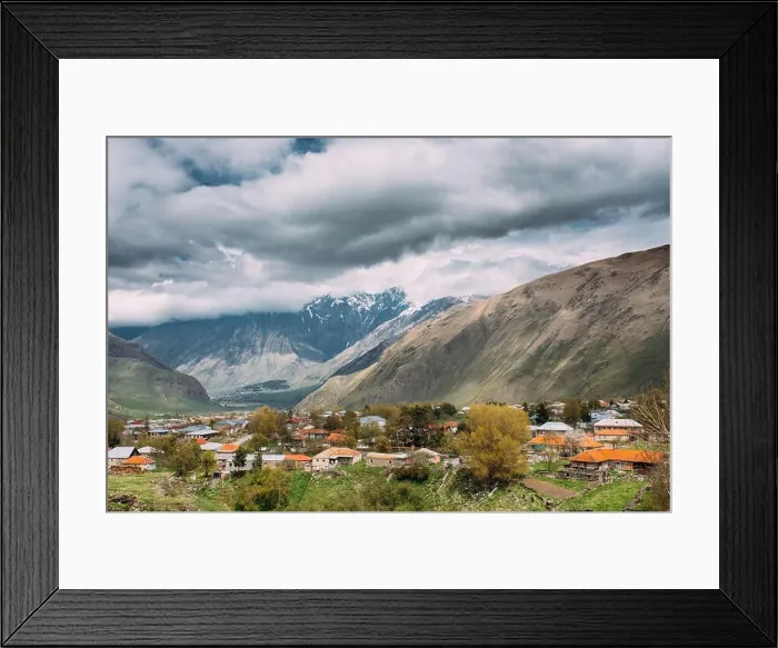 Framed Print : Sioni Village On Mountain Background In Kazbegi District, Mtskheta-Mtianeti Region, Georgia. Spring Or Summer Season Framed Print : Sioni Village On Mountain Background In Kazbegi District, Mtskheta-Mtianeti Region, Georgia. Spring Or Summer Season