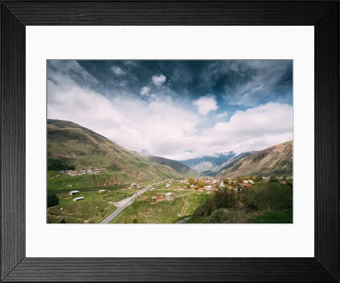 Framed Print : Sioni Village On Mountain Background In Kazbegi District, Mtskheta-Mtianeti Region, Georgia. Spring Or Summer Season Framed Print : Sioni Village On Mountain Background In Kazbegi District, Mtskheta-Mtianeti Region, Georgia. Spring Or Summer Season