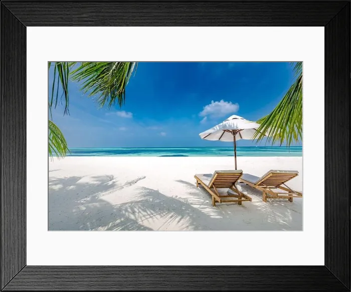 Framed Print : Beautiful tropical beach, two sun beds, loungers, umbrella under palm tree. White sand, sea view horizon, blue sky, calmness and relax resort scenery Framed Print : Beautiful tropical beach, two sun beds, loungers, umbrella under palm tree. White sand, sea view horizon, blue sky, calmness and relax resort scenery