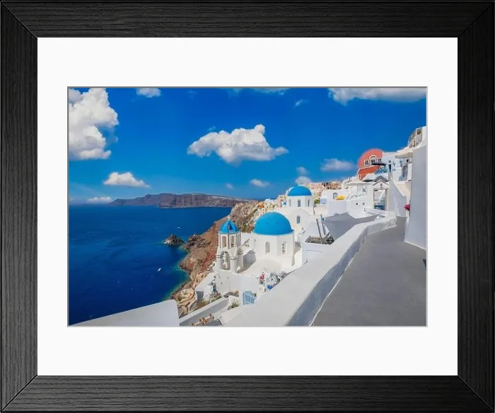 Framed Print : Amazing panoramic landscape, luxury travel vacation. Oia town on Santorini island, Greece. Traditional and famous houses and churches with blue domes Framed Print : Amazing panoramic landscape, luxury travel vacation. Oia town on Santorini island, Greece. Traditional and famous houses and churches with blue domes