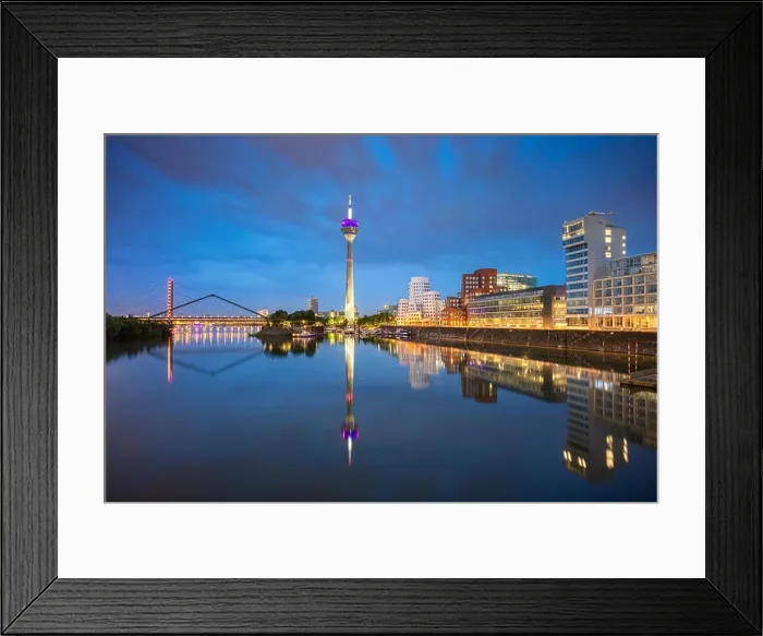 Framed Print : Dusseldorf, Germany. Cityscape image of Düsseldorf, Germany with the Media Harbour and reflection of the city in the Rhine river Framed Print : Dusseldorf, Germany. Cityscape image of Düsseldorf, Germany with the Media Harbour and reflection of the city in the Rhine river