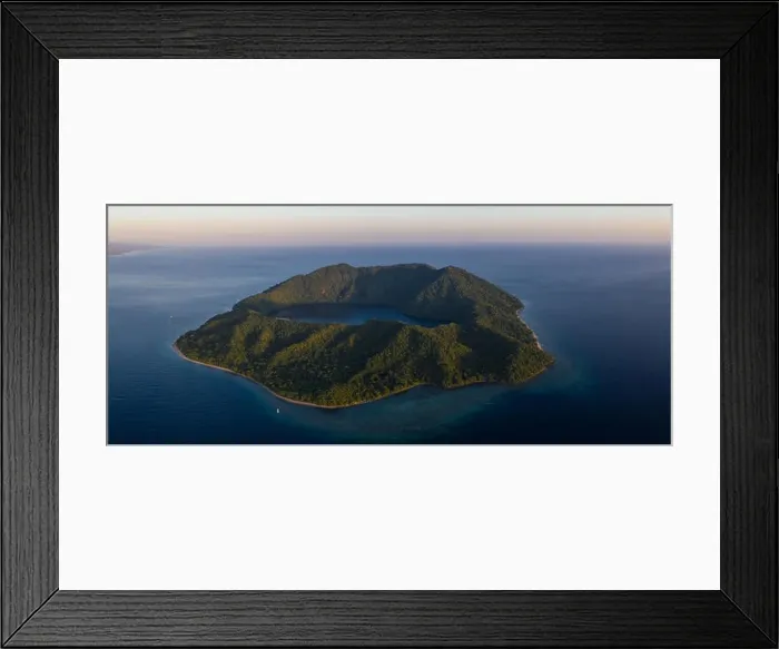 Framed Print : Seen from a bird's eye view, the blue Pacific Ocean surrounds the scenic volcano of Satonda, just north of Sumbawa in Indonesia Framed Print : Seen from a bird's eye view, the blue Pacific Ocean surrounds the scenic volcano of Satonda, just north of Sumbawa in Indonesia