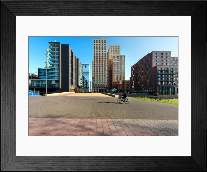 Framed Print : Amsterdam skyscraper, Netherlands. Office buildings in Amsterdam Zuid, Amsterdam, Netherlands. People bicycling in Amsterdam, Netherlands Framed Print : Amsterdam skyscraper, Netherlands. Office buildings in Amsterdam Zuid, Amsterdam, Netherlands. People bicycling in Amsterdam, Netherlands