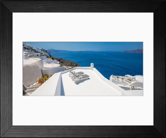 Framed Print : Beautiful travel background for vacation holiday banner. White houses in the town of Oia on the island of Santorini, panorama. Amazing scenic views Framed Print : Beautiful travel background for vacation holiday banner. White houses in the town of Oia on the island of Santorini, panorama. Amazing scenic views