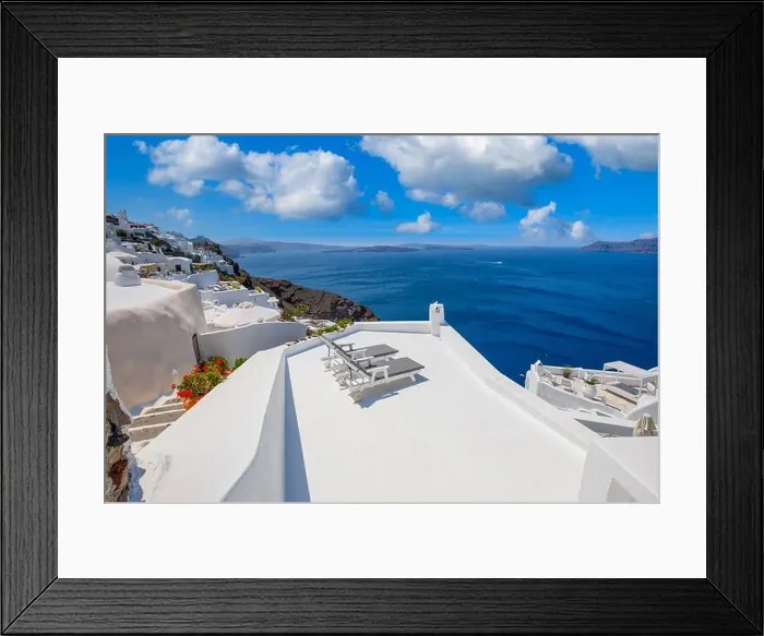 Framed Print : Beautiful travel background for vacation holiday banner. White houses in the town of Oia on the island of Santorini, panorama. Amazing scenic views