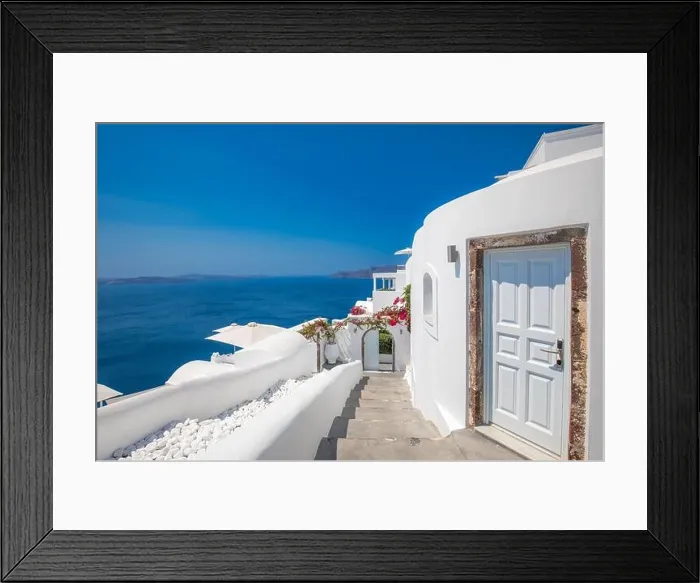 Framed Print : White wash staircases and entrance on Santorini Island, Greece. The view toward Caldera sea view. Famous tourism attraction, destination scenic Framed Print : White wash staircases and entrance on Santorini Island, Greece. The view toward Caldera sea view. Famous tourism attraction, destination scenic