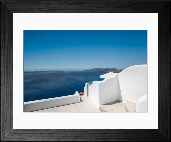 Framed Print : White wash staircases and entrance on Santorini Island, Greece. The view toward Caldera sea view. Famous tourism attraction, destination scenic Framed Print : White wash staircases and entrance on Santorini Island, Greece. The view toward Caldera sea view. Famous tourism attraction, destination scenic