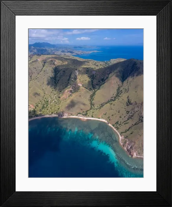 Framed Print : Seen from an aerial view, afternoon light shines on rugged islands in Komodo National Park, Indonesia. This area has high marine biodiversity Framed Print : Seen from an aerial view, afternoon light shines on rugged islands in Komodo National Park, Indonesia. This area has high marine biodiversity