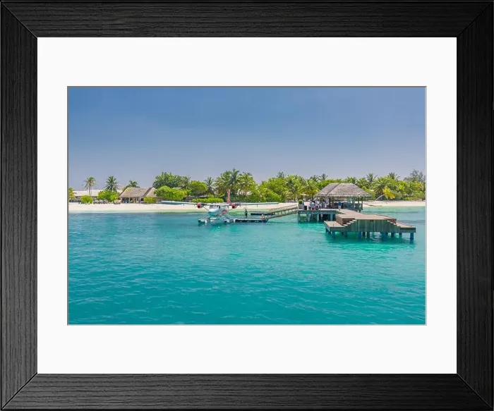 Framed Print : Wooden pier and jetty with seaplane at tropical island resort, Maldives. Luxury summer travel. Arrive at summer holiday vacation island landscape Framed Print : Wooden pier and jetty with seaplane at tropical island resort, Maldives. Luxury summer travel. Arrive at summer holiday vacation island landscape