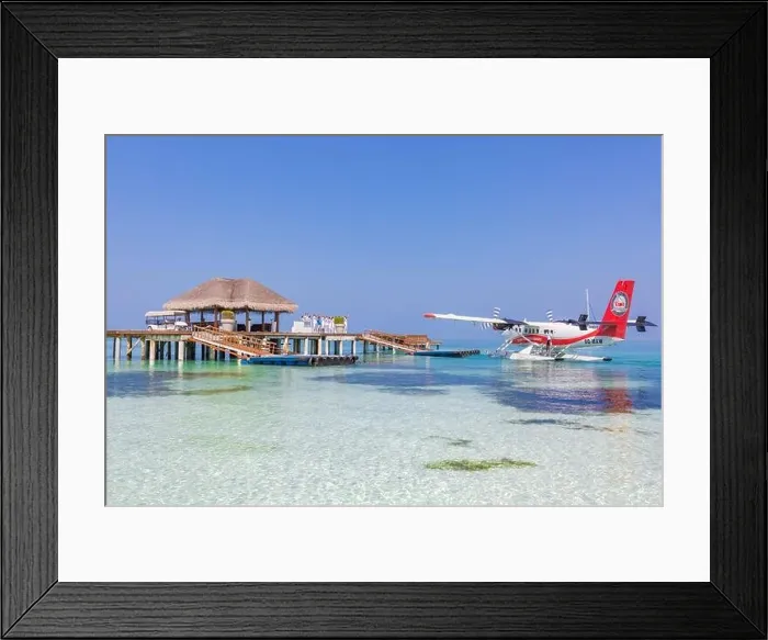 Framed Print : Ari Atoll, Maldives - 05.05.2018: Maldives seaplane on luxury resort, wooden jetty loading the plane, ready for departure. Tropical island tourism Framed Print : Ari Atoll, Maldives - 05.05.2018: Maldives seaplane on luxury resort, wooden jetty loading the plane, ready for departure. Tropical island tourism