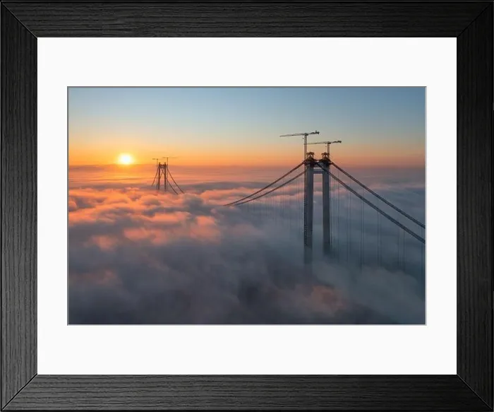 Framed Print : Panoramic aerial drone view from above of the suspended bridge over danube river, under construction, between Braila and Tulcea cities in Romania