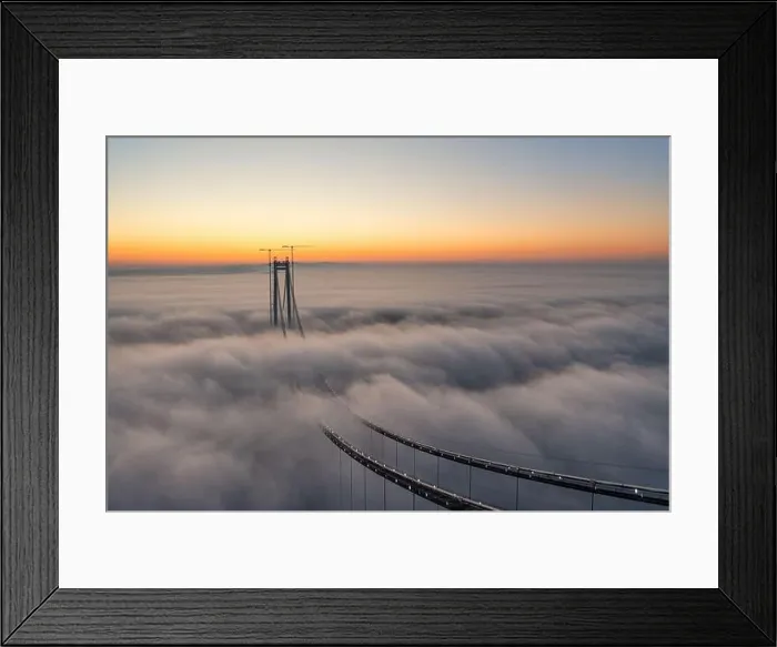 Framed Print : Panoramic aerial drone view from above of the suspended bridge over danube river, under construction, between Braila and Tulcea cities in Romania Framed Print : Panoramic aerial drone view from above of the suspended bridge over danube river, under construction, between Braila and Tulcea cities in Romania