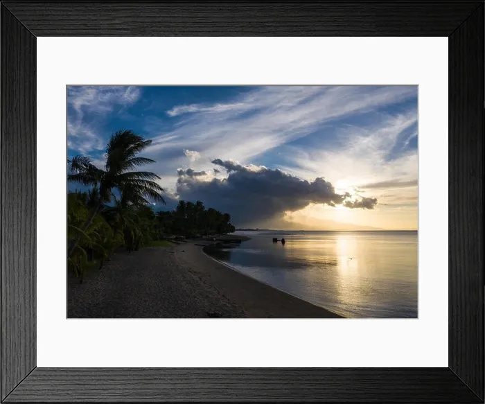 Framed Print : Seen from an aerial view, the tropical island of Flores is illuminated at sunset. Flores is part of the Lesser Sunda Islands of Indonesia