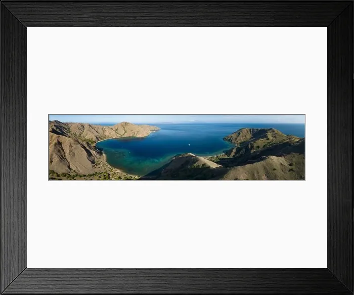 Framed Print : Sunlight illuminates the beautiful coastline of an island near Komodo in Indonesia. This region is known for its spectacular marine biodiversity Framed Print : Sunlight illuminates the beautiful coastline of an island near Komodo in Indonesia. This region is known for its spectacular marine biodiversity