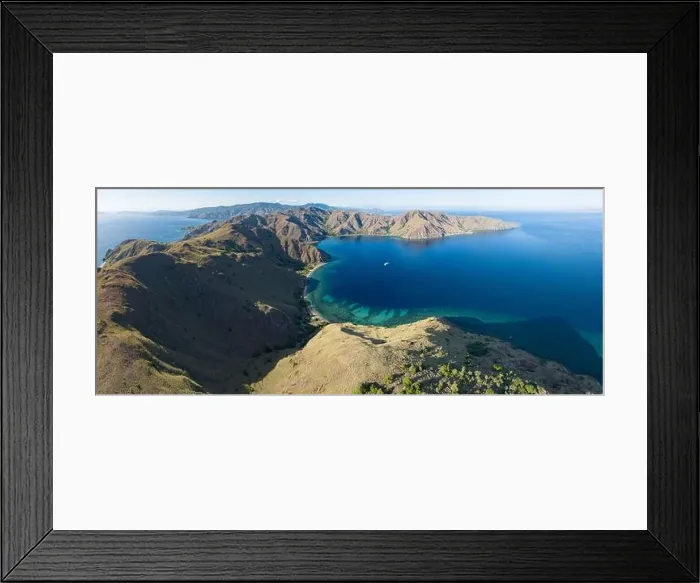 Framed Print : Sunlight illuminates the beautiful coastline of an island near Komodo in Indonesia. This region is known for its spectacular marine biodiversity Framed Print : Sunlight illuminates the beautiful coastline of an island near Komodo in Indonesia. This region is known for its spectacular marine biodiversity