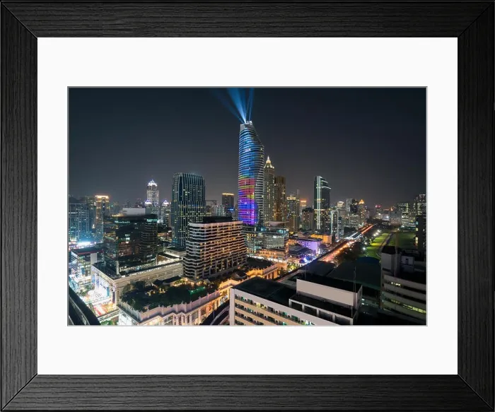 Framed Print : Night view with skyscraper in business district in Bangkok Thailand. Light show at Magnolias Ratchaprasong in Bangkok, Thailand Framed Print : Night view with skyscraper in business district in Bangkok Thailand. Light show at Magnolias Ratchaprasong in Bangkok, Thailand