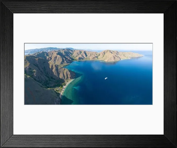 Framed Print : Sunlight illuminates the beautiful coastline of an island near Komodo in Indonesia. This region is known for its spectacular marine biodiversity Framed Print : Sunlight illuminates the beautiful coastline of an island near Komodo in Indonesia. This region is known for its spectacular marine biodiversity