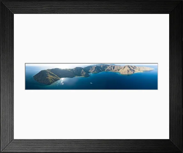 Framed Print : Sunlight illuminates the beautiful coastline of an island near Komodo in Indonesia. This region is known for its spectacular marine biodiversity Framed Print : Sunlight illuminates the beautiful coastline of an island near Komodo in Indonesia. This region is known for its spectacular marine biodiversity