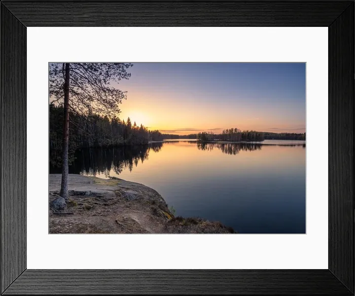 Framed Print : Scenic landscape with sunset, peaceful lake and tree roots at calm spring evening in Finland Framed Print : Scenic landscape with sunset, peaceful lake and tree roots at calm spring evening in Finland