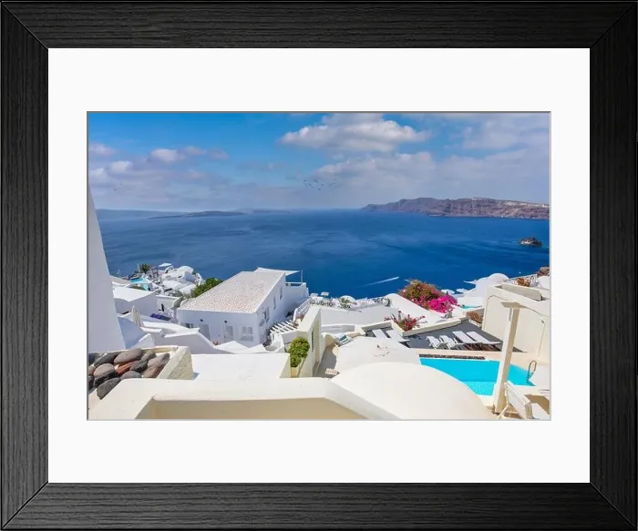 Framed Print : Oia town on Santorini island, Greece. Traditional famous white blue houses stairs, pathways under sunny blue sky Caldera, Aegean sea. Beautiful summer Framed Print : Oia town on Santorini island, Greece. Traditional famous white blue houses stairs, pathways under sunny blue sky Caldera, Aegean sea. Beautiful summer