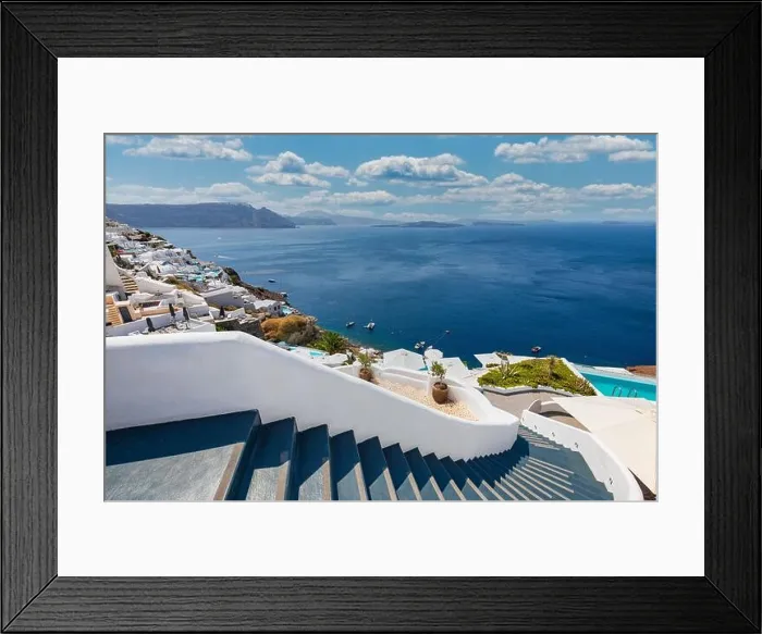 Framed Print : Oia town on Santorini island, Greece. Traditional famous white blue houses stairs, pathways under sunny blue sky Caldera, Aegean sea. Beautiful summer