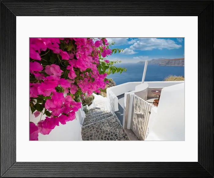 Framed Print : Greek island of Santorini. Amazing travel panorama, white houses, stairs and flowers on the streets. Idyllic summer vacation, urban landscape, tourism Framed Print : Greek island of Santorini. Amazing travel panorama, white houses, stairs and flowers on the streets. Idyllic summer vacation, urban landscape, tourism
