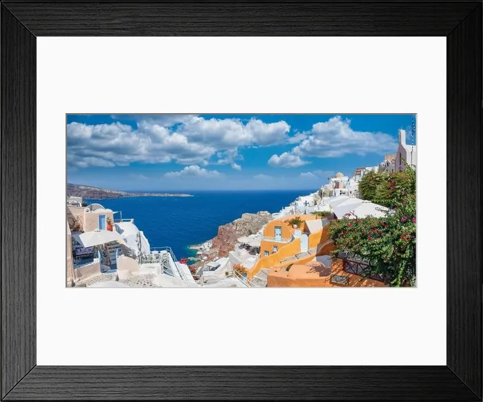 Framed Print : Greek island of Santorini. Amazing travel panorama, white houses, stairs and flowers on the streets. Idyllic summer vacation, urban landscape, Oia Framed Print : Greek island of Santorini. Amazing travel panorama, white houses, stairs and flowers on the streets. Idyllic summer vacation, urban landscape, Oia