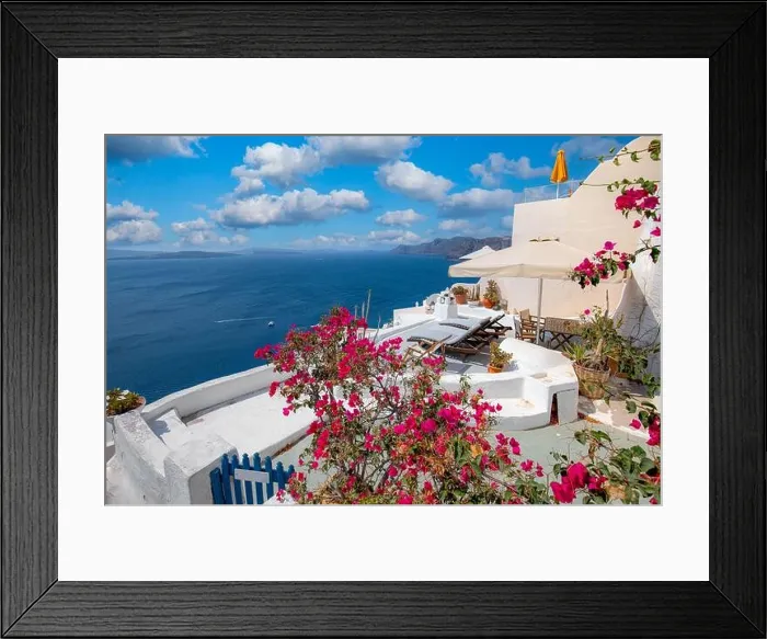 Framed Print : Relaxing and romantic view with white architecture in Santorini Greece, caldera view over blue sea and volcano island. Summer landscape for travelling Framed Print : Relaxing and romantic view with white architecture in Santorini Greece, caldera view over blue sea and volcano island. Summer landscape for travelling