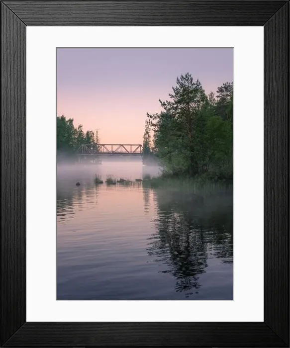 Framed Print : Foggy summer landscape and old iron bridge with beautiful calm lake at summer night in Finland