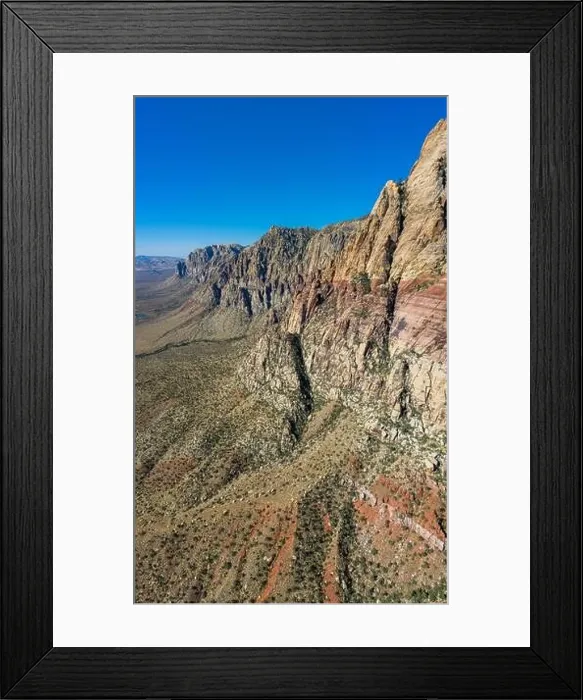 Framed Print : An aerial view shows a rugged mountain landscape that rises from the desert surrounding Las Vegas, Nevada. This dry area averages over 95 degrees F Framed Print : An aerial view shows a rugged mountain landscape that rises from the desert surrounding Las Vegas, Nevada. This dry area averages over 95 degrees F