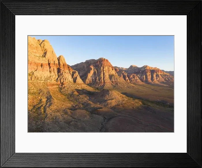 Framed Print : An aerial view shows a rugged mountain landscape that rises from the desert surrounding Las Vegas, Nevada. This dry area averages over 95 degrees F Framed Print : An aerial view shows a rugged mountain landscape that rises from the desert surrounding Las Vegas, Nevada. This dry area averages over 95 degrees F