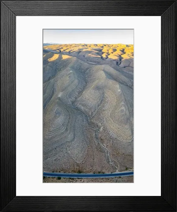 Framed Print : An aerial view shows a rugged mountain landscape that rises from the desert surrounding Las Vegas, Nevada. This dry area averages over 95 degrees F Framed Print : An aerial view shows a rugged mountain landscape that rises from the desert surrounding Las Vegas, Nevada. This dry area averages over 95 degrees F